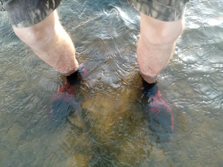 Cooling off feet in the water