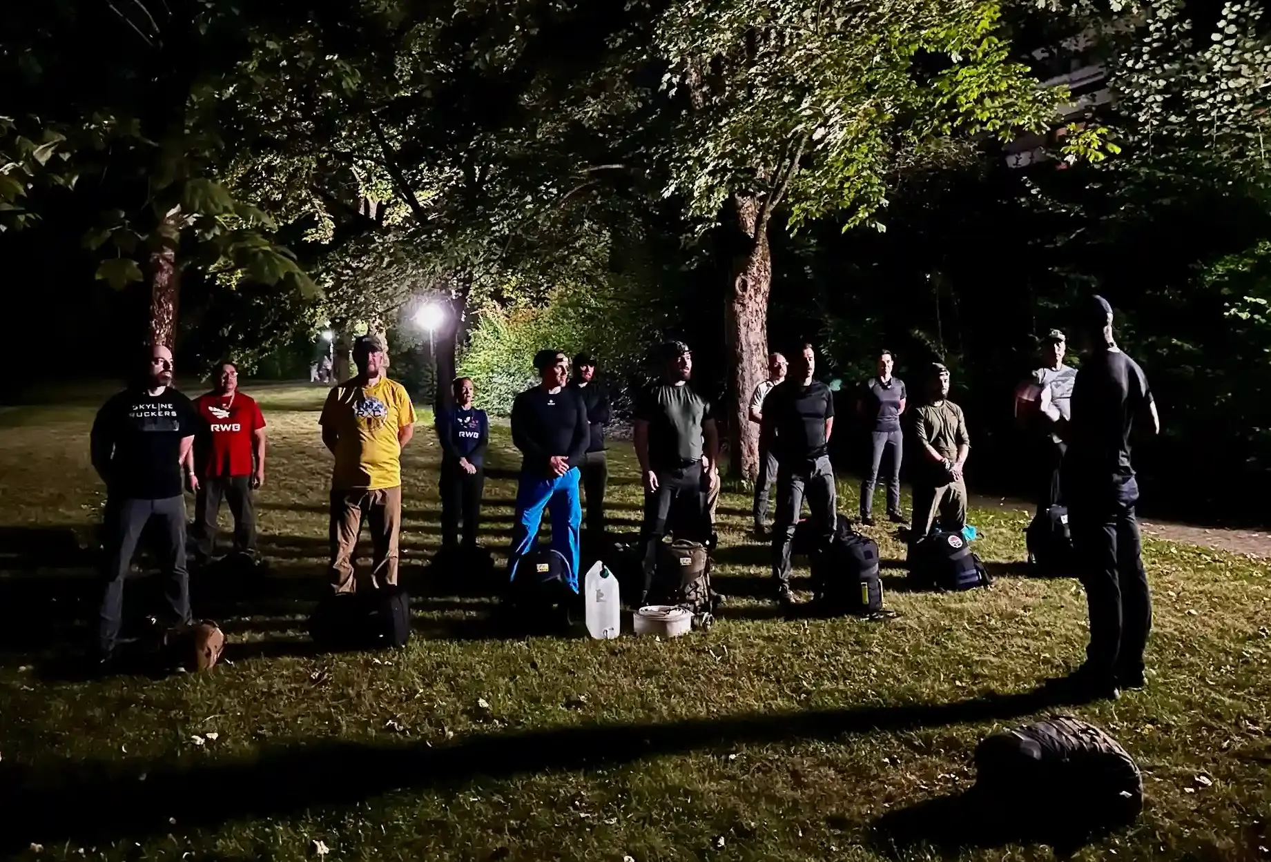 The team stands in formation while Cadre Jassy gives his opening speech