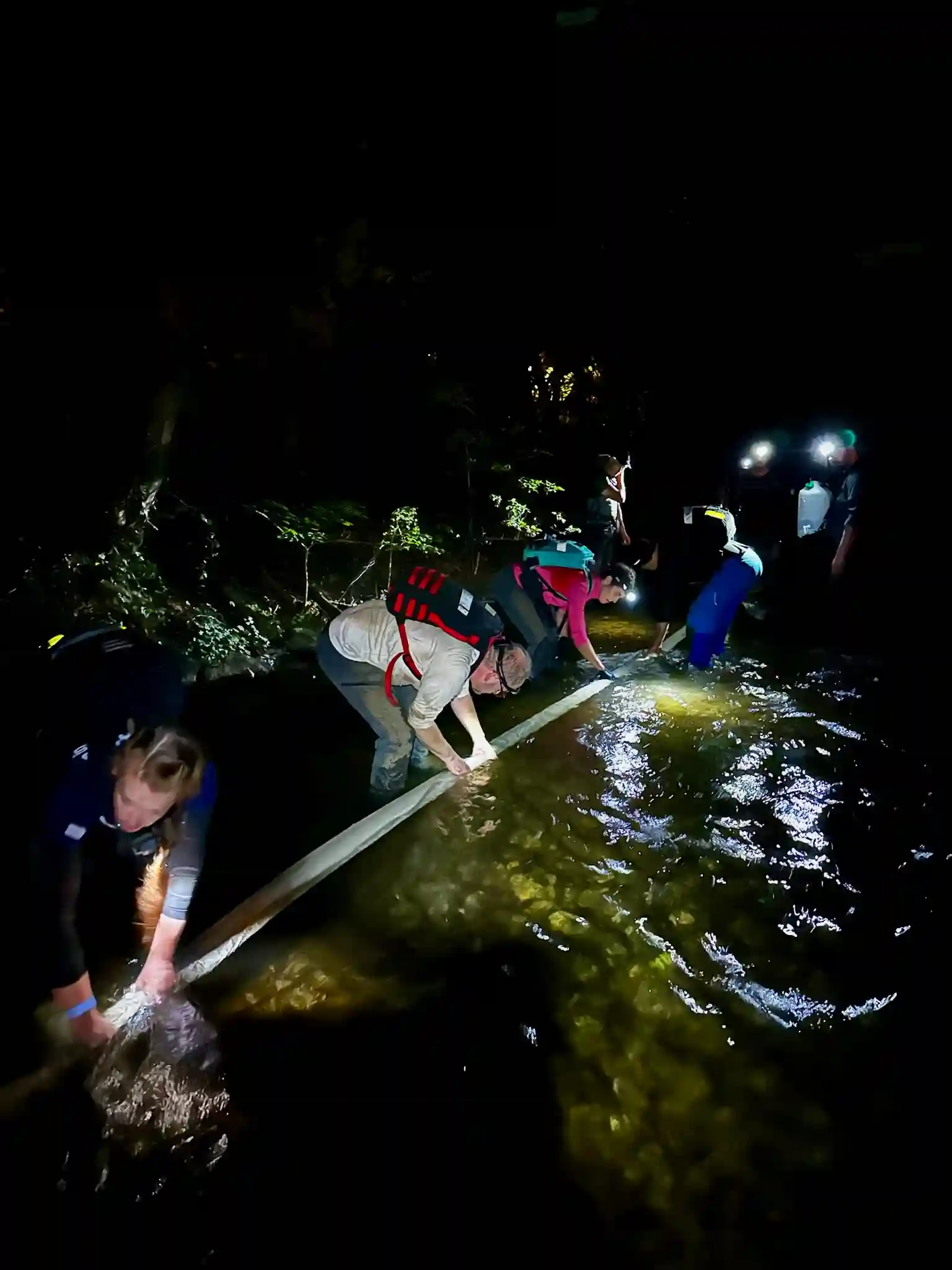 The team assisting in filling up the fire hose.