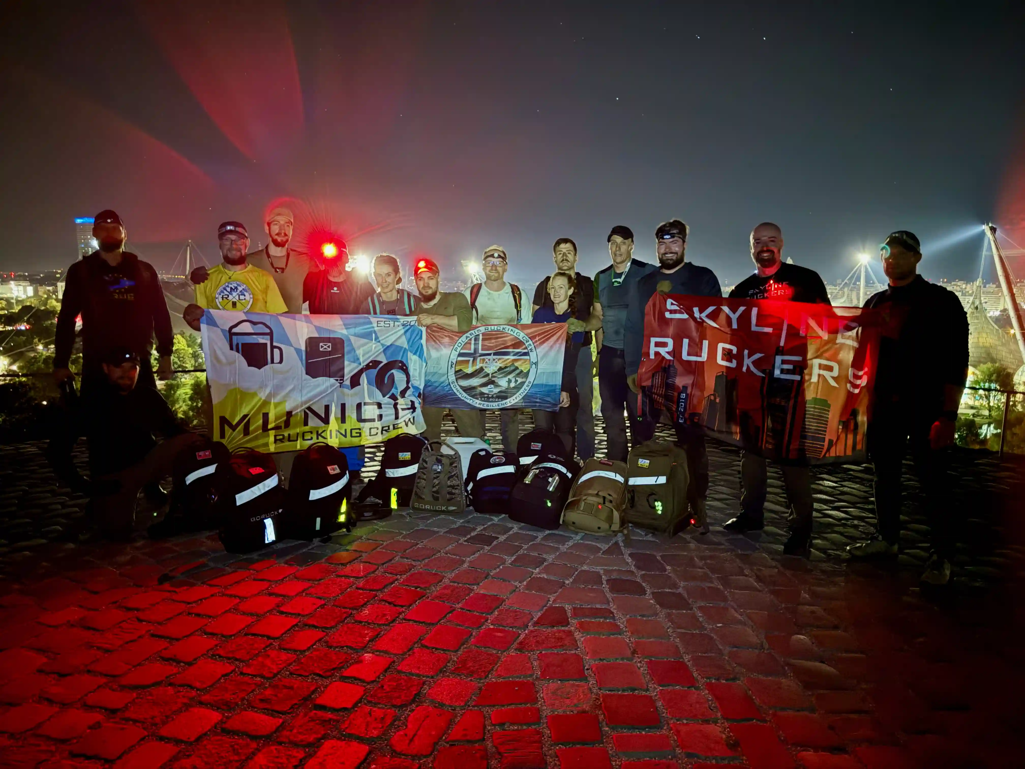 Group picture on top of the Olympic hill at night