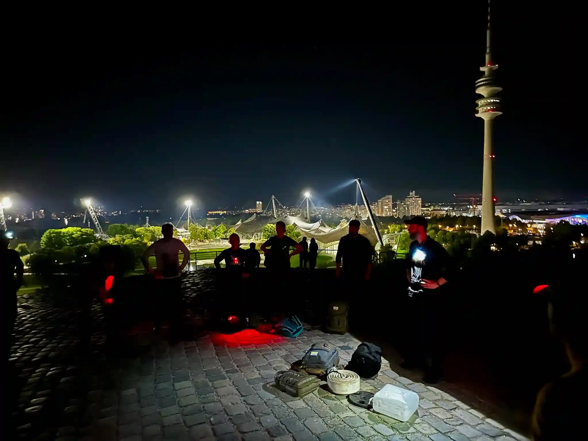The team listening to Cadre Jassy on top of the Olympic hill
