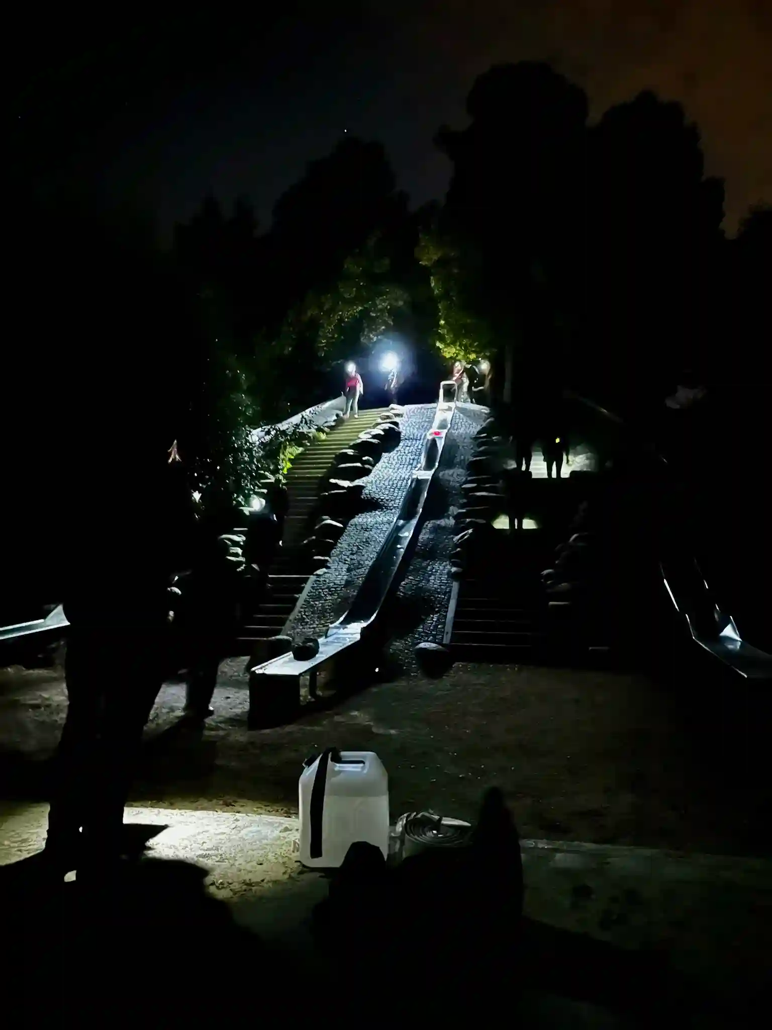 The team executing the burden of Sisyphus with sandbags.