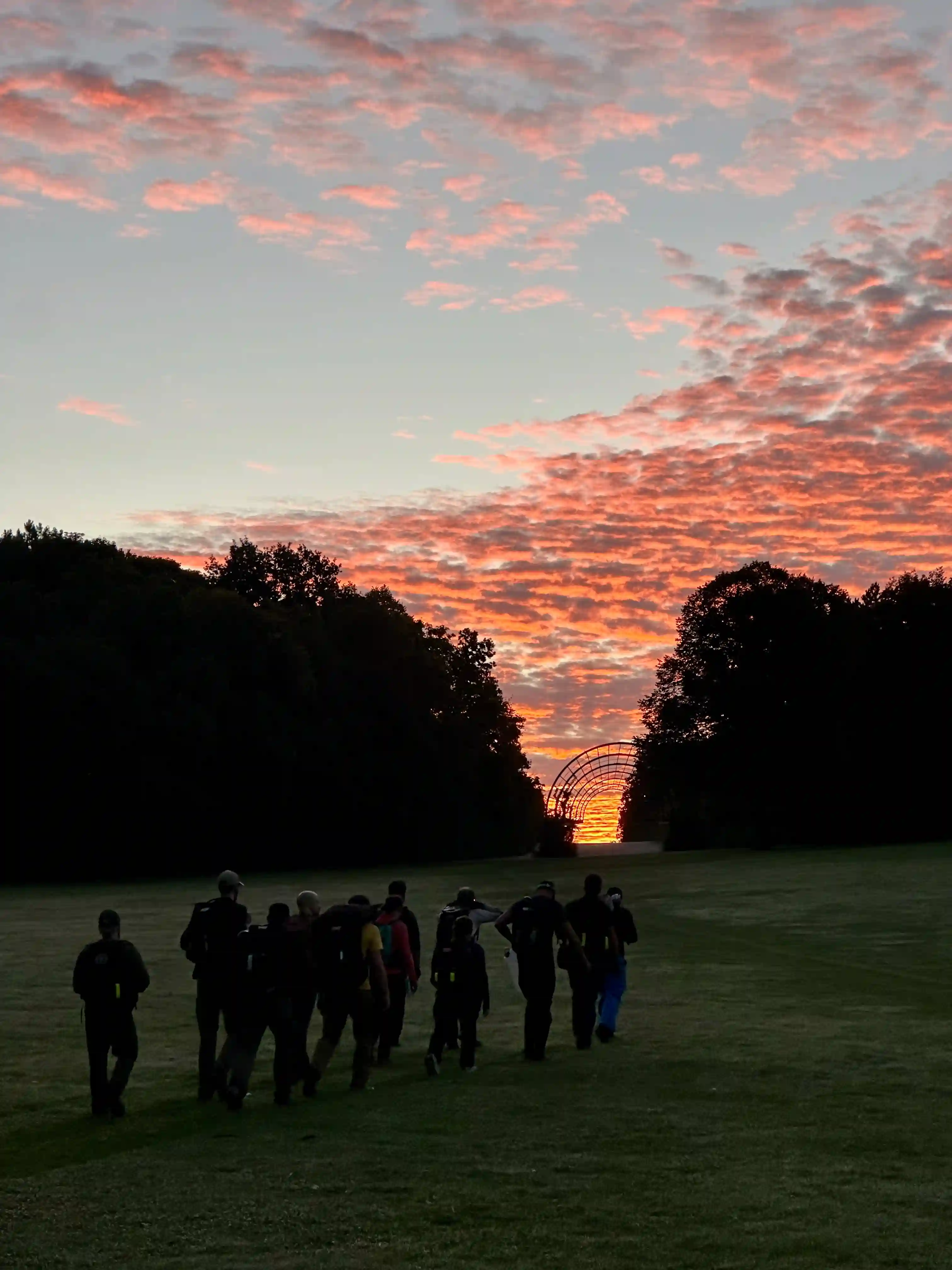 The team walking towards the sunrise.