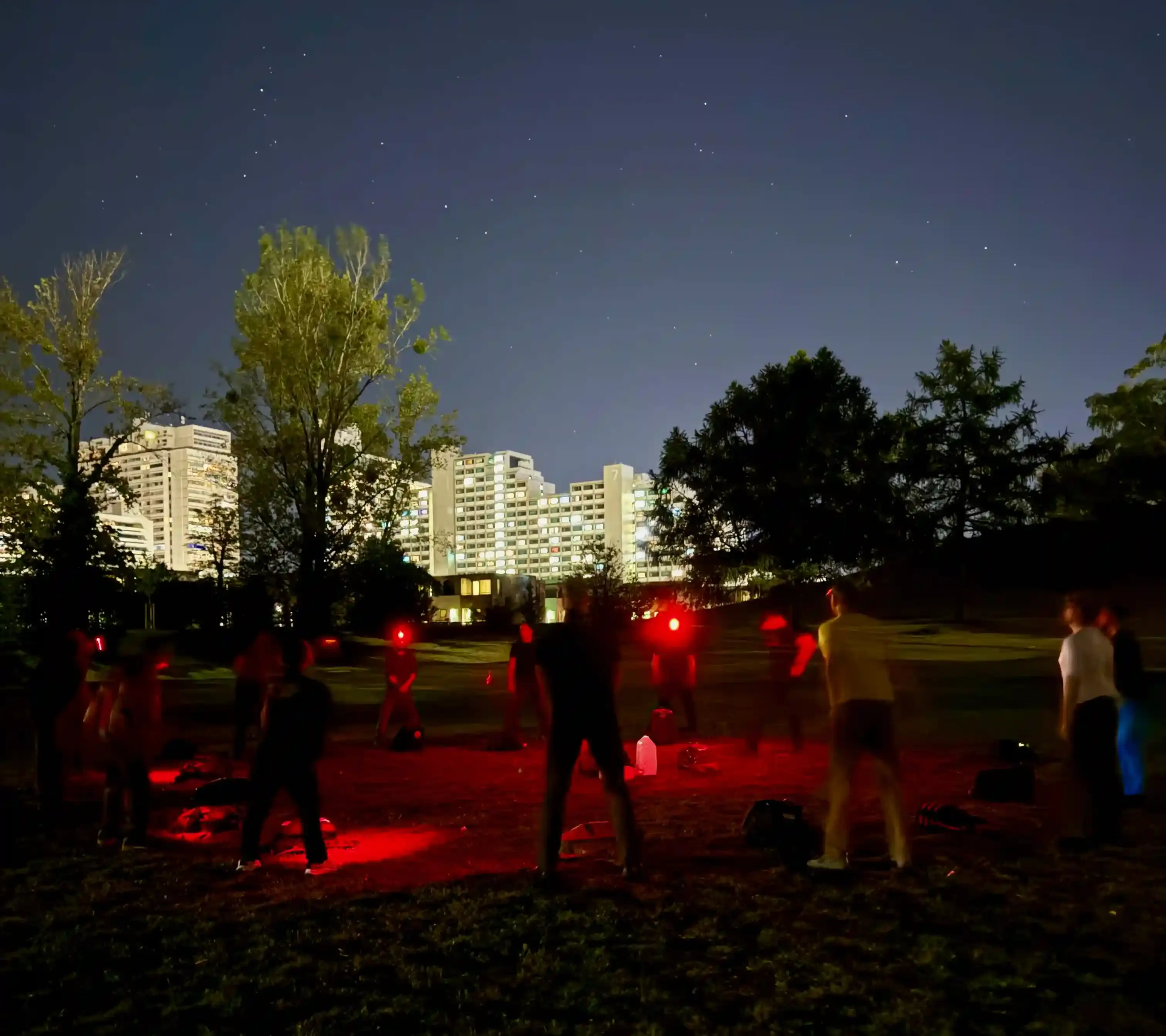 The team stands around in a circle awaiting for the next exercise to be announced